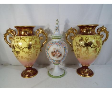 A pair of large twin handled ceramic vases with gild foliate decoration approximately 37 cm [h] and a milk glass lidded vase,