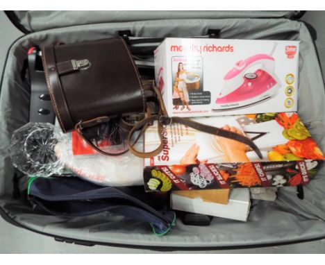 A good quality Antler suitcase containing a quantity of miscellaneous items to include a cased set of Ross binoculars, Morphy