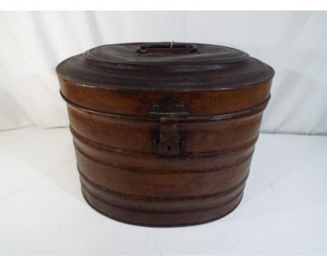 A vintage hat box with leather effect, lock marked Machine Made Lever with Modern Improvements, with key, approx 30cm x 41cm 
