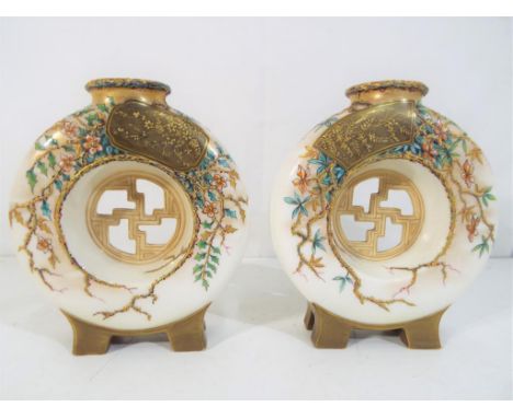 Royal Worcester - A pair of Royal Worcester moon flasks decorated in an oriental style, printed and incised marks to the base