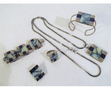Pierre Cardin - a white metal panelled designer Pierre Cardin set of jewellery, comprising necklace, torque bracelet and ring