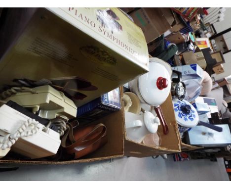 Three boxes containing a mixed lot to include vintage cameras, unused retail stock, vintage enamelled kitchen ware, ceramics,