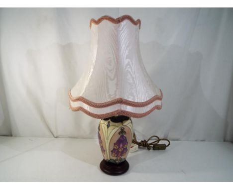 Moorcroft Pottery - a Moorcroft Pottery table lamp and shade, decorated in the foxglove pattern, approximately 28 cm [h] to t