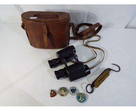 A pair of Watson - Baker binoculars, dated 1942, inscribed Watson-Baker Co Limited, #6.E/29 5761 with leather protective case
