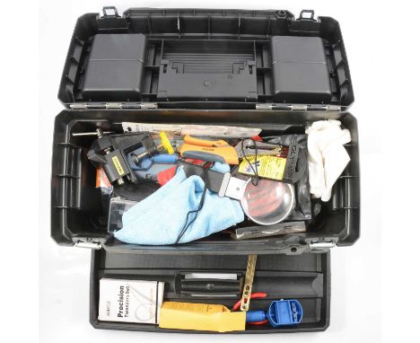 Plastic crate and Stanley tool box of modern watch tools and accessories including cleaning fluids, wire wool, etc.