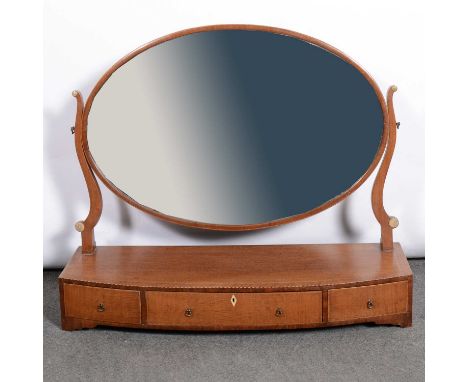 George III style inlaid mahogany toilet mirror, late 19th century, oval plate, bow front platform base fitted with three draw