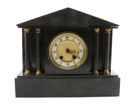 Victorian black slate mantel clock, the case of architectural form, cylinder movement striking on a gong, height 28cm.