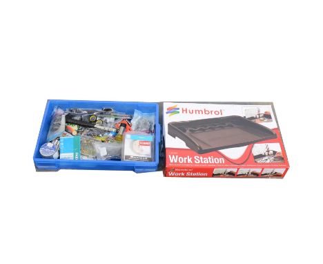 A box of model making equipment including workstation.