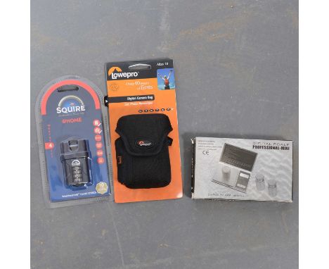 A box of various padlocks, garden knives and gate locks.