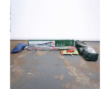 A box of various garden tools including a leaf collectors and various outside games