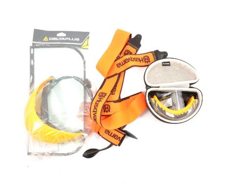 Chainsaw accessories, including Husqvarna trousers, Stihl harness, blades, kneepads, visor.