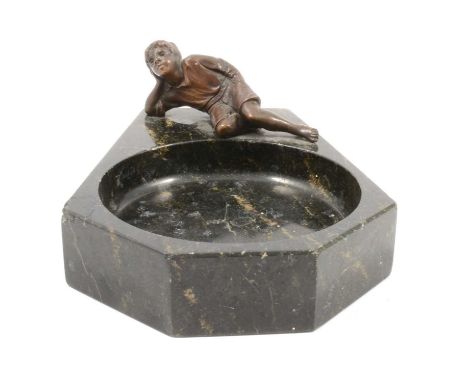 Belge Noir marble ashtray with a bronzed model of a reclining boy, length 15cm.