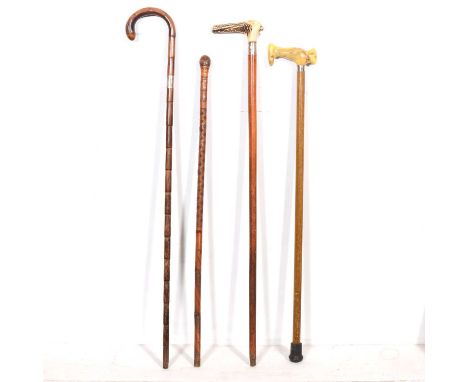 A cane walking stick with silver collar; a walking stick with horn handle and white metal collar; a walking stick with simula