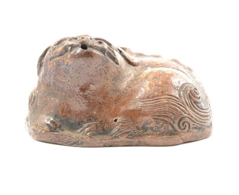 Archaic style Chinese stoneware model of a Buddhistic temple dog, width 9cm.