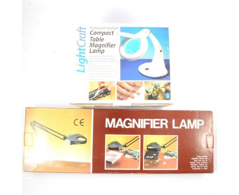 A Lightcraft compact table magnifying light, Sinatra arm floor lamp and a magnifier lamp.