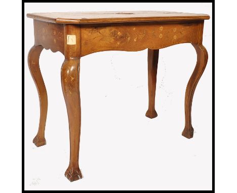 A Regency 19th century Irish marquetry inlaid console / writing table, possibly Killarney. The table being raised on cabriole