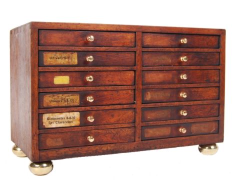 An antique vintage late 19th century to early 20th century small proportioned mahogany letterpress / printers chest. The ches