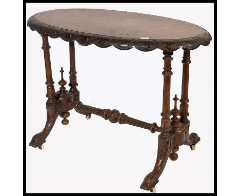 A 19th century High Victorian mahogany and marquetry inlaid ladies writing table desk. Raised on turned legs with white ceram