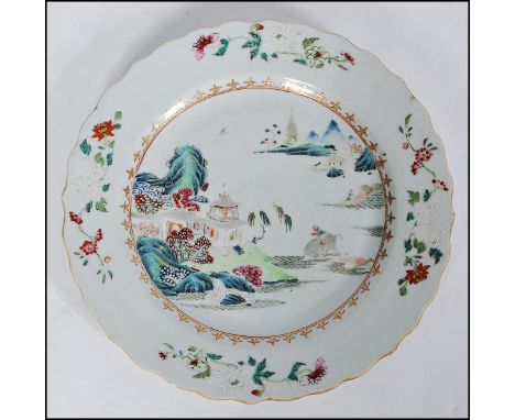 A 17th / 18th century period Chinese Famille Rose / Verte plate - Kangxi period (1662-1722) Painted to the well with a lakesi