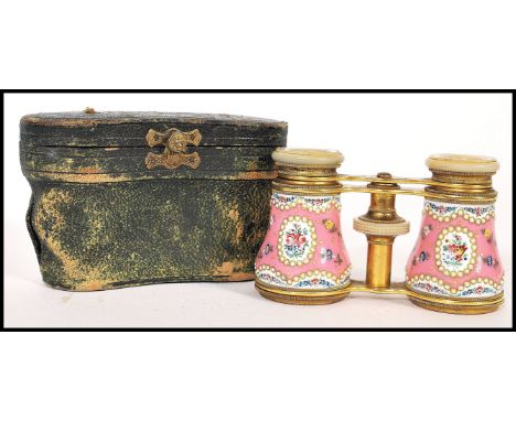 A fantastic pair of 19th century French gilt brass enamel and seed pearl opera glasses complete in fitted leather case. Pink 
