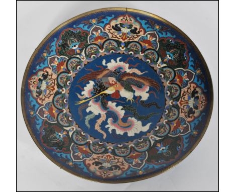 A 19th century Japanese Meijiÿ period (1868-1912) Japanese cloisonne enamel charger. Of roundel form, the large charger with 