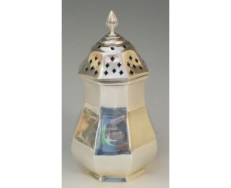 A silver sugar caster of octagonal baluster form, circle and diamond pierced cover with ribbed finial, by John Grinsell & Son