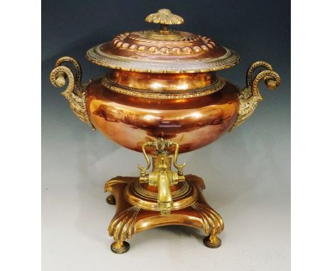 A Regency copper and brass samovar of compressed urnular shape, embossed domed lid with ornate embossed finial, pair of leaf 