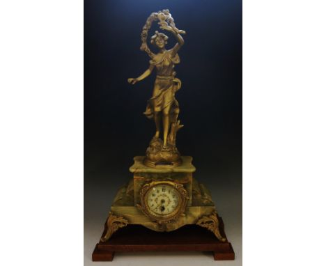 A late 19th Century French gilt metal and onyx mantel clock, the onyx veneered case enclosing a cream enamel dial with Arabic