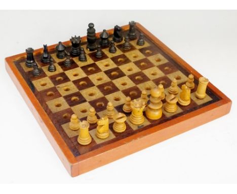 A Barnards Board for the Blind chess set, the board inlaid in rosewood within a mahogany stained frame pierced overall, chess