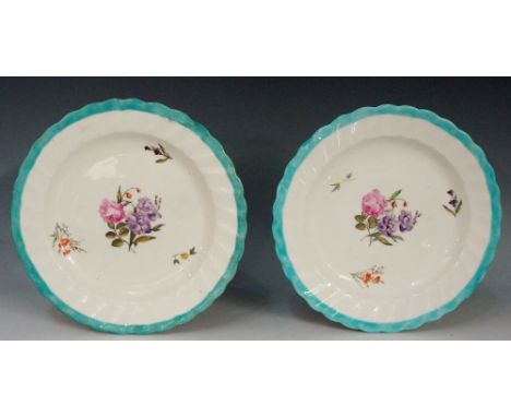 Pinxton - a pair of William Billingsley decorated shaped circular plates with fluted borders, the centres painted with floral