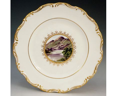 A John McLaughlin shaped circular cabinet plate, painted to the centre with a mountainous scene, signed J McLaughlin, gilt bo