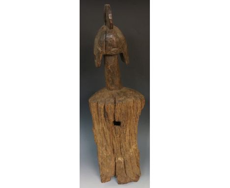 An African trunk carved tribal figure, the head with stylised headdress and ears on a tall neck, 75cm high