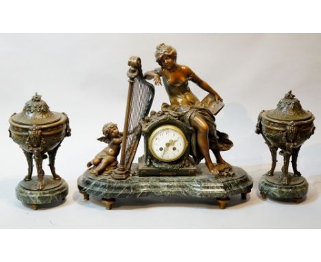 August Moreau (after) - a three piece bronzed white metal clock set comprising clock and pair of lidded urns, the clock with 