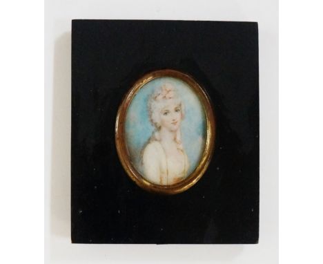 A 19th Century oval portrait miniature, head and shoulders of a young woman with pink ribbon in her hair, watercolour on ivor