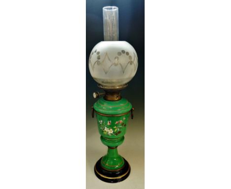 A Victorian opaque green glass oil lamp, the slightly tapered cylindrical body enamelled with butterflies, flowers and leafag
