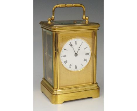 A 19th Century French Drocot brass cased repeating carriage clock with engine turned ormolu face enclosing a white enamel dia
