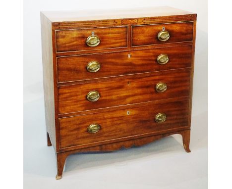 A Regency mahogany chest of drawers with caddy top outlined with ebonised stringing, the frieze centred on a hatched rectangu