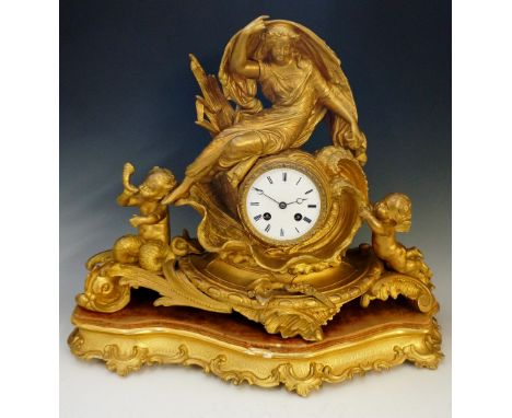 A French ormolu mantel clock of Rococo style, the white enamel dial with Roman numerals indistinctly inscribed...Paris, the d