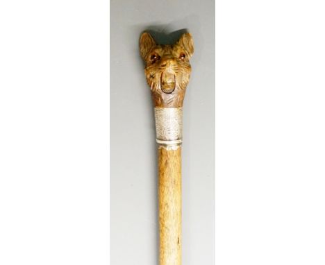 A late Victorian walking stick, the automaton Black Forest handle carved as a cat's head with amber glass eyes, moveable jaw 