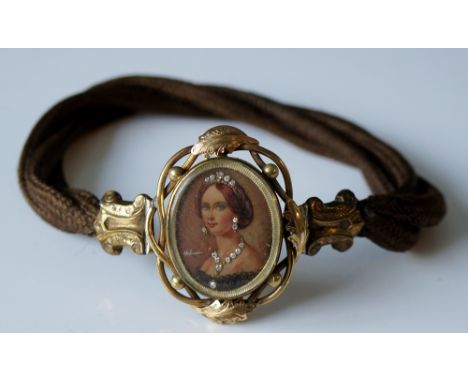 A Victorian gilt metal mounted jeweled oval head and shoulder portrait miniature plaque choker, within pierced and interlaced