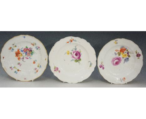Two Meissen shaped circular plates painted with floral sprays, 23.5cm diameter; another similar continental shaped circular p