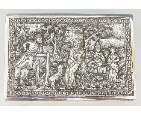 An Indian? silver coloured metal trinket box, the hinged lid chased and embossed with rural scene depicting two women holding