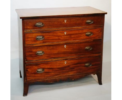 A Regency mahogany chest of drawers, the top outlined with boxwood and ebony stringing above four long graduated drawers, sha