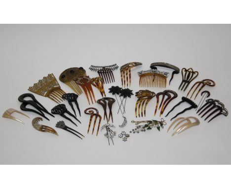 A collection of late 19th and early 20th century haircombs and hairslides, including: faux tortoiseshell, celluloid and early