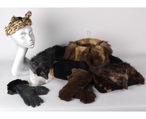 A quantity of vintage fur garments, including: a fur muff with fox head to the front, several collars, muffs, gloves and othe