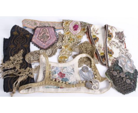 A collection of 19th and 20th century passmenterie, comprising metallic lace, fragments of costume, an embroidered panel deco