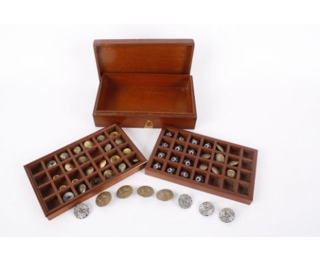 A collection of buttons contained within a mahogany box, including: a set of blue and red patterned enamel buttons, brass Art