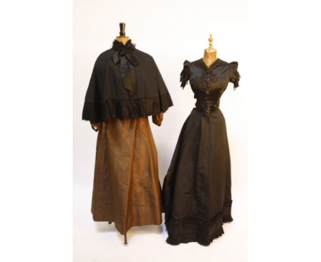 A late 19th century brown silk taffeta two-piece costume; a Victorian black silk blouse with pin-tucks and embroidered decora