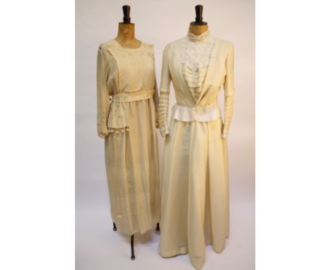 An Edwardian white cotton dress with broderie Anglaise detail, an early 20th century cream crepe dress, a soft black velvet j