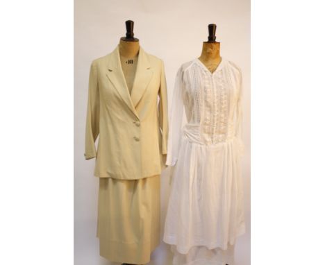 A quantity of early 20th century costume, comprising: an Edwardian cream flannel two-piece suit with shop label 'Gold, tailor